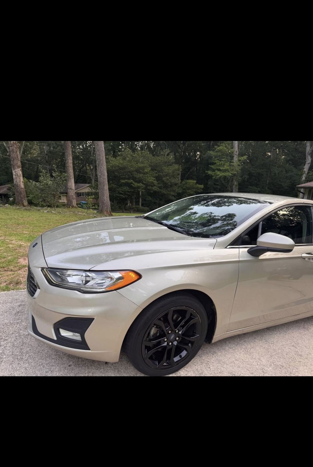 Gold Ford Fusion available for rent