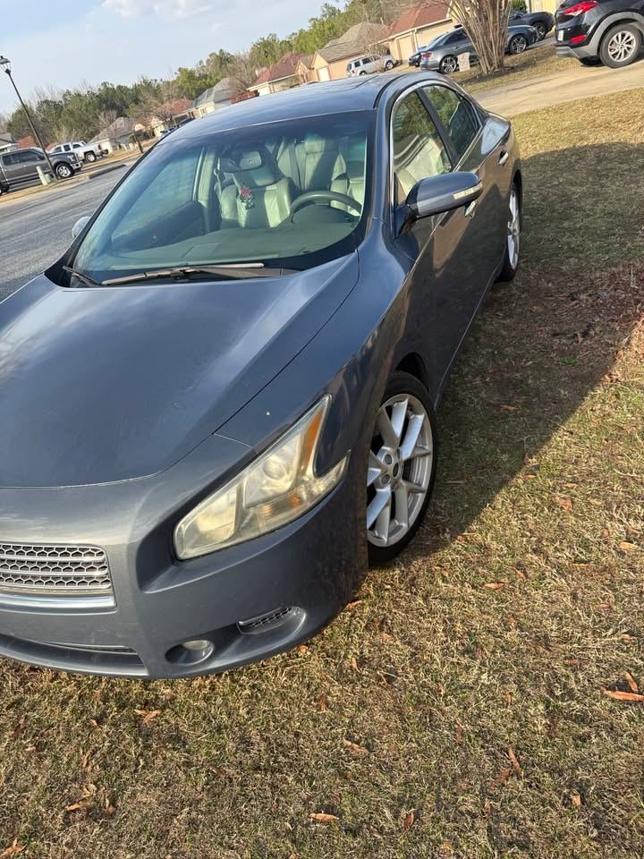 Gray Nissan Maxima available for rent