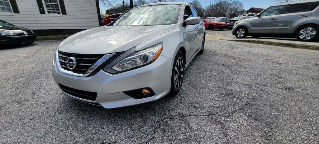 Silver Nissan Altima available for rent
